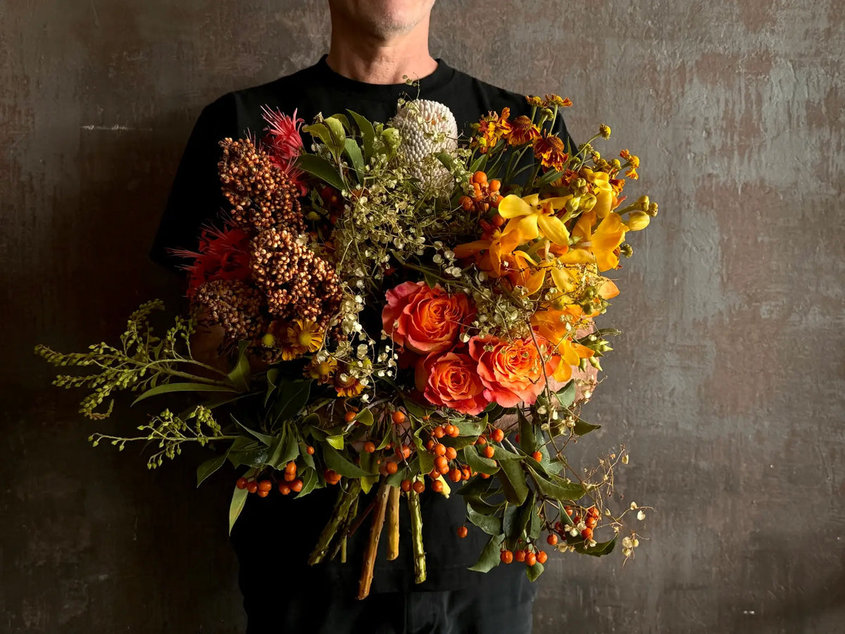 Florist holding a hand-tied bouquet ready for flower delivery to Surry Hills